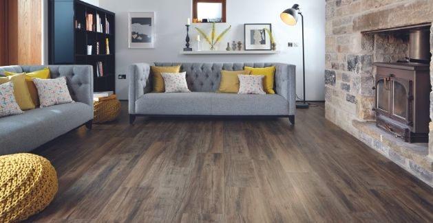 wood-look vinyl plank floors in a cozy living room with grey and yellow